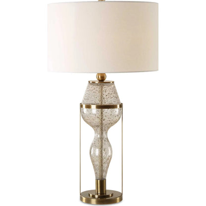 Out of Time Seeded Glass Table Lamp by Uttermost in brass. Made from iron, glass, fabric in a modern style.