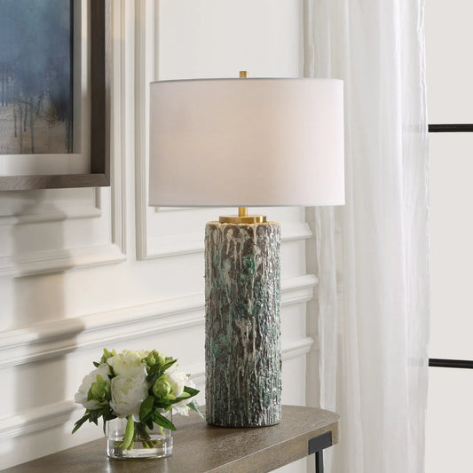 Meltdown Table Lamp by Uttermost in brass. Made from ceramic, iron, fabric in a unique style.