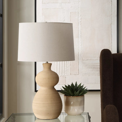 Pueblo Fired Clay Table Lamp by Uttermost in brass. Made from ceramic, metal, fabric in a transitional style.