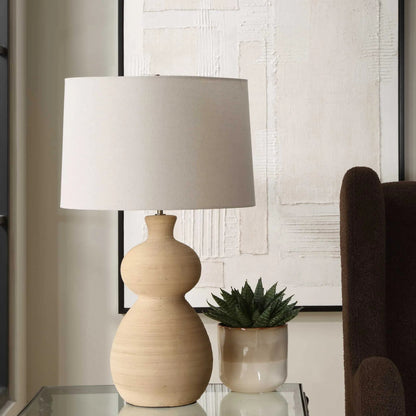 Pueblo Fired Clay Table Lamp by Uttermost in brass. Made from ceramic, metal, fabric in a transitional style.
