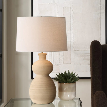 Pueblo Fired Clay Table Lamp by Uttermost in brass. Made from ceramic, metal, fabric in a transitional style.