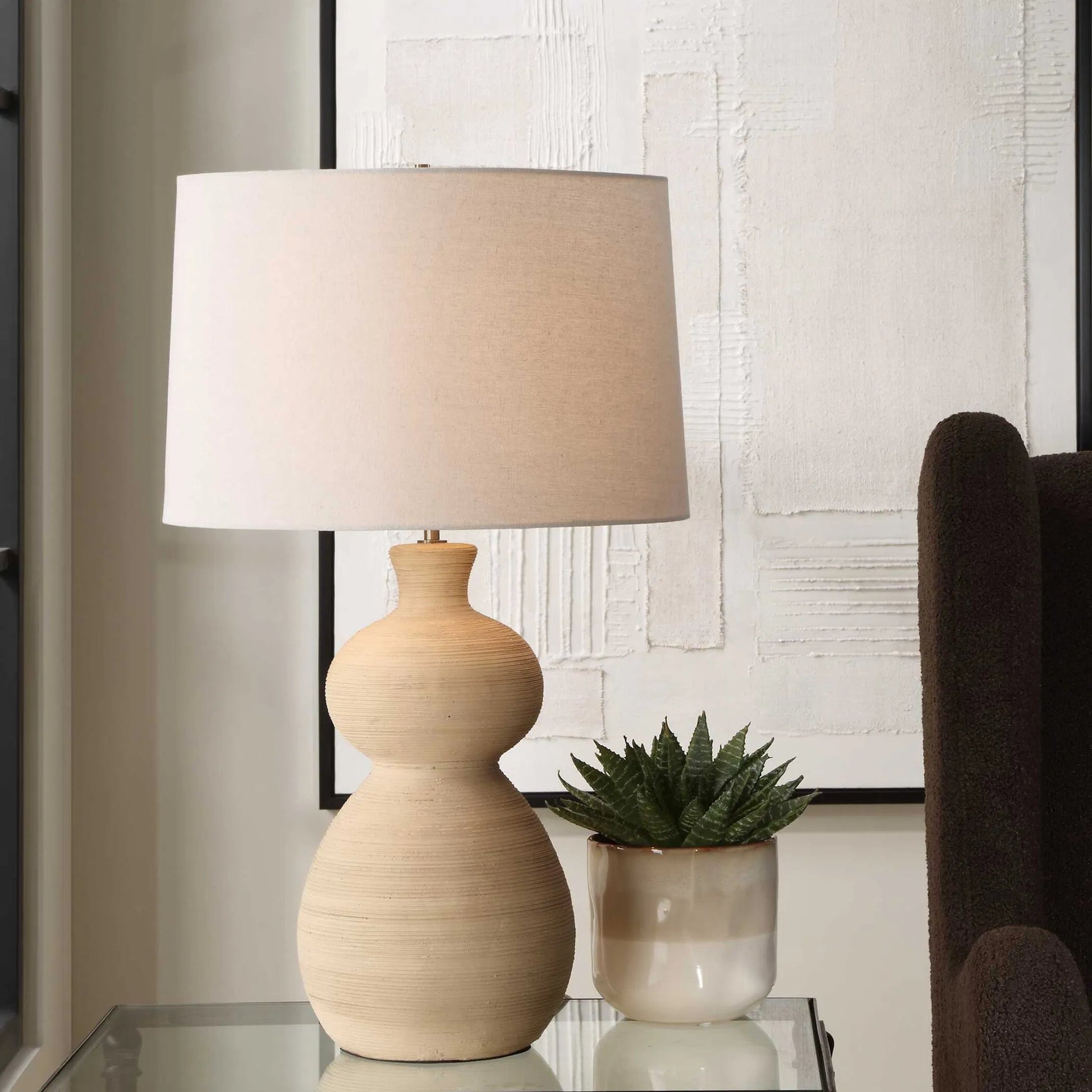 Pueblo Fired Clay Table Lamp by Uttermost in brass. Made from ceramic, metal, fabric in a transitional style.