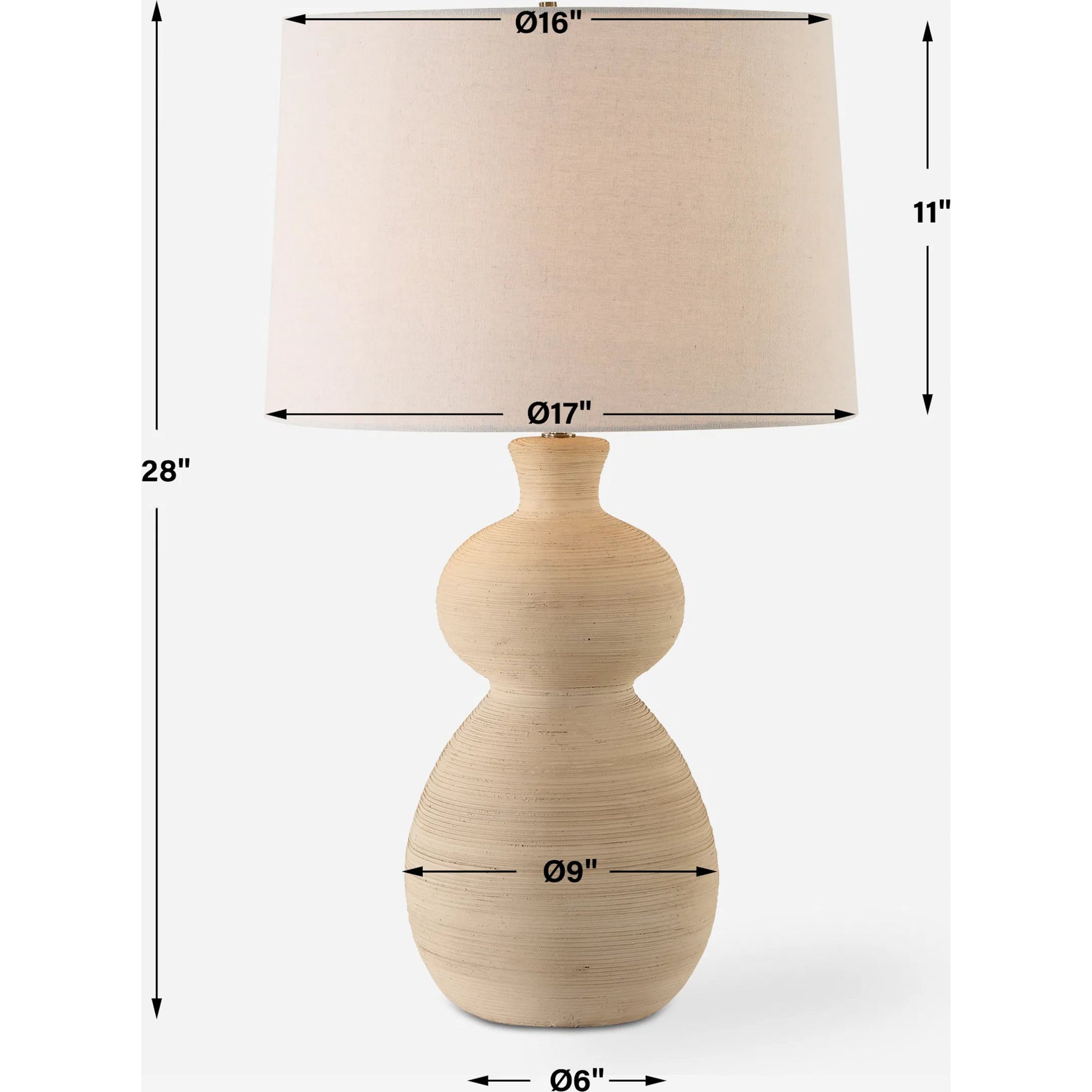 Pueblo Fired Clay Table Lamp by Uttermost in brass. Made from ceramic, metal, fabric in a transitional style.