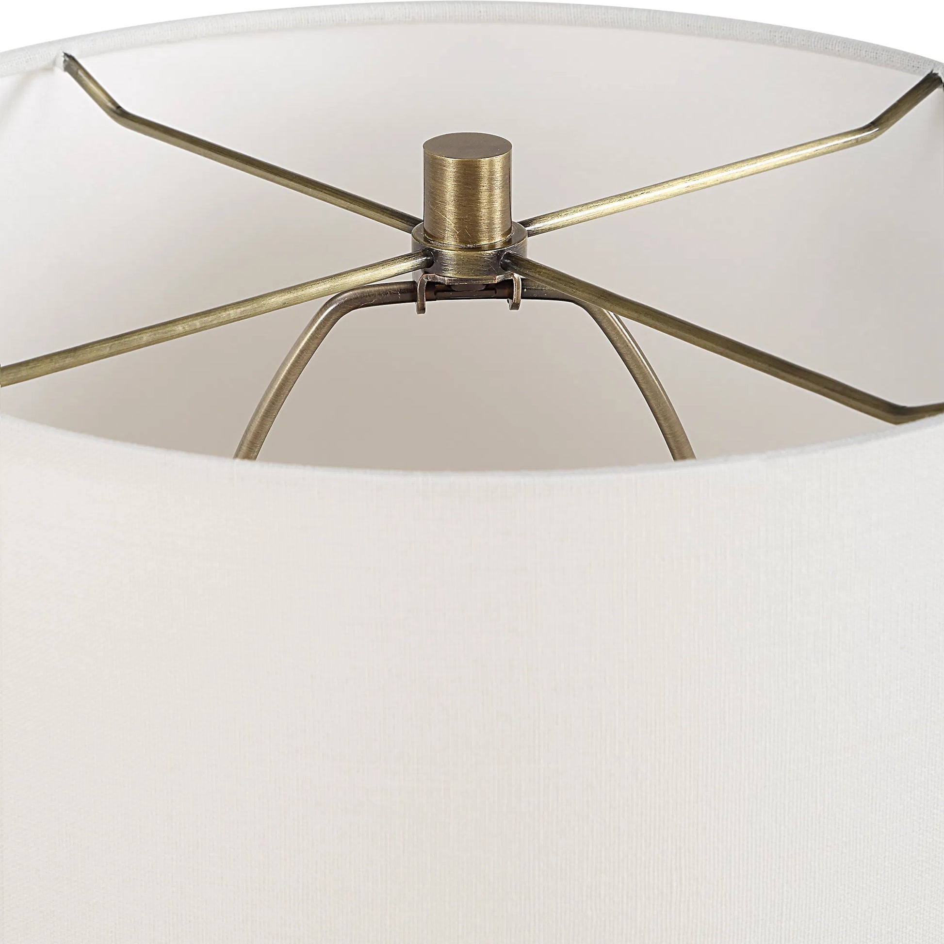 Abyss Table Lamp by Uttermost in brass. Made from iron, ceramic, fabric in a modern style.
