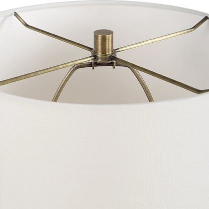Abyss Table Lamp by Uttermost in brass. Made from iron, ceramic, fabric in a modern style.