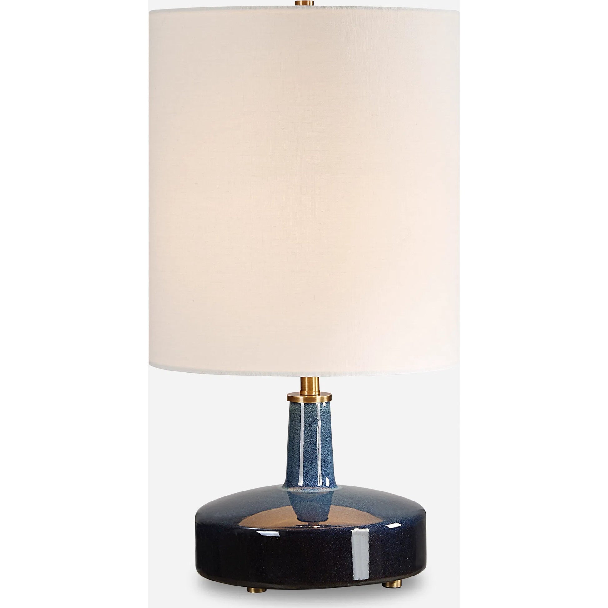Abyss Table Lamp by Uttermost in brass. Made from iron, ceramic, fabric in a modern style.