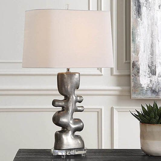 Free Flowing Table Lamp by Uttermost in nickel. Made from steel, crystal, ceramic, fabric in a modern style.