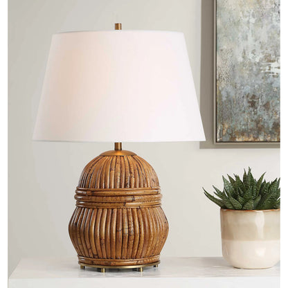 Reed Honey Rattan Table Lamp by Uttermost in brass. Made from steel, rattan, fabric in a rustic style.