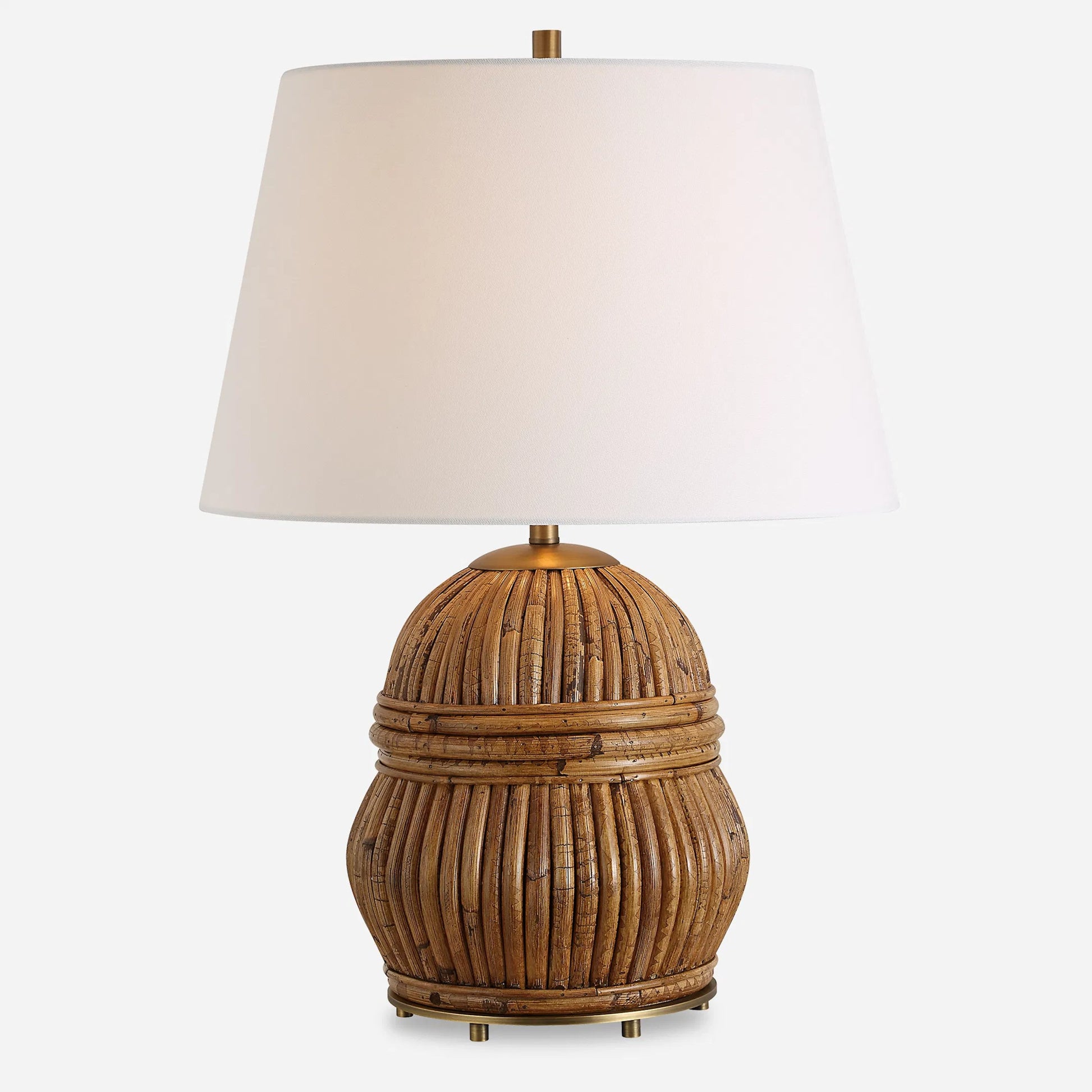 Reed Honey Rattan Table Lamp by Uttermost in brass. Made from steel, rattan, fabric in a rustic style.