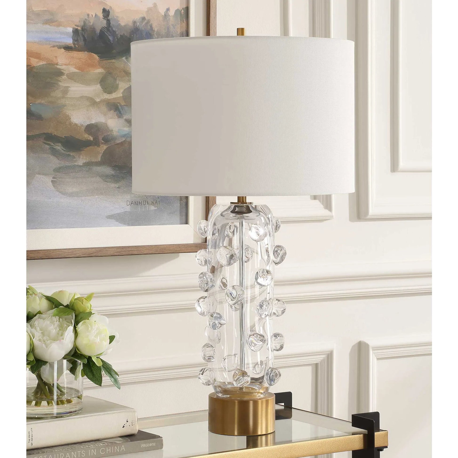 Aura Clear Glass Table Lamp by Uttermost in brass. Made from glass, iron, fabric in a modern style.