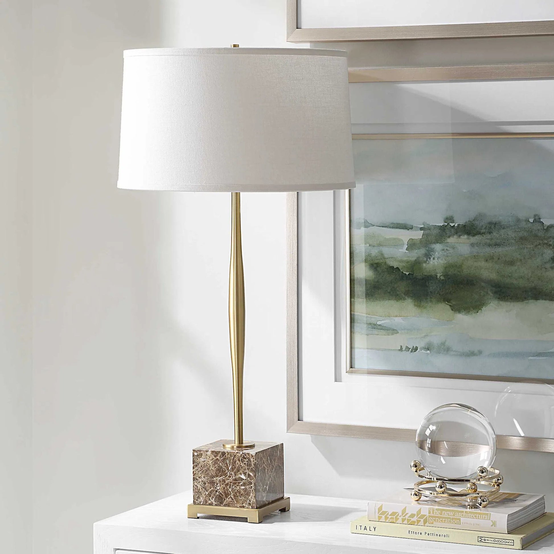 Booker Thin Table Lamp by Uttermost in brass. Made from marble, iron, fabric in a modern style.