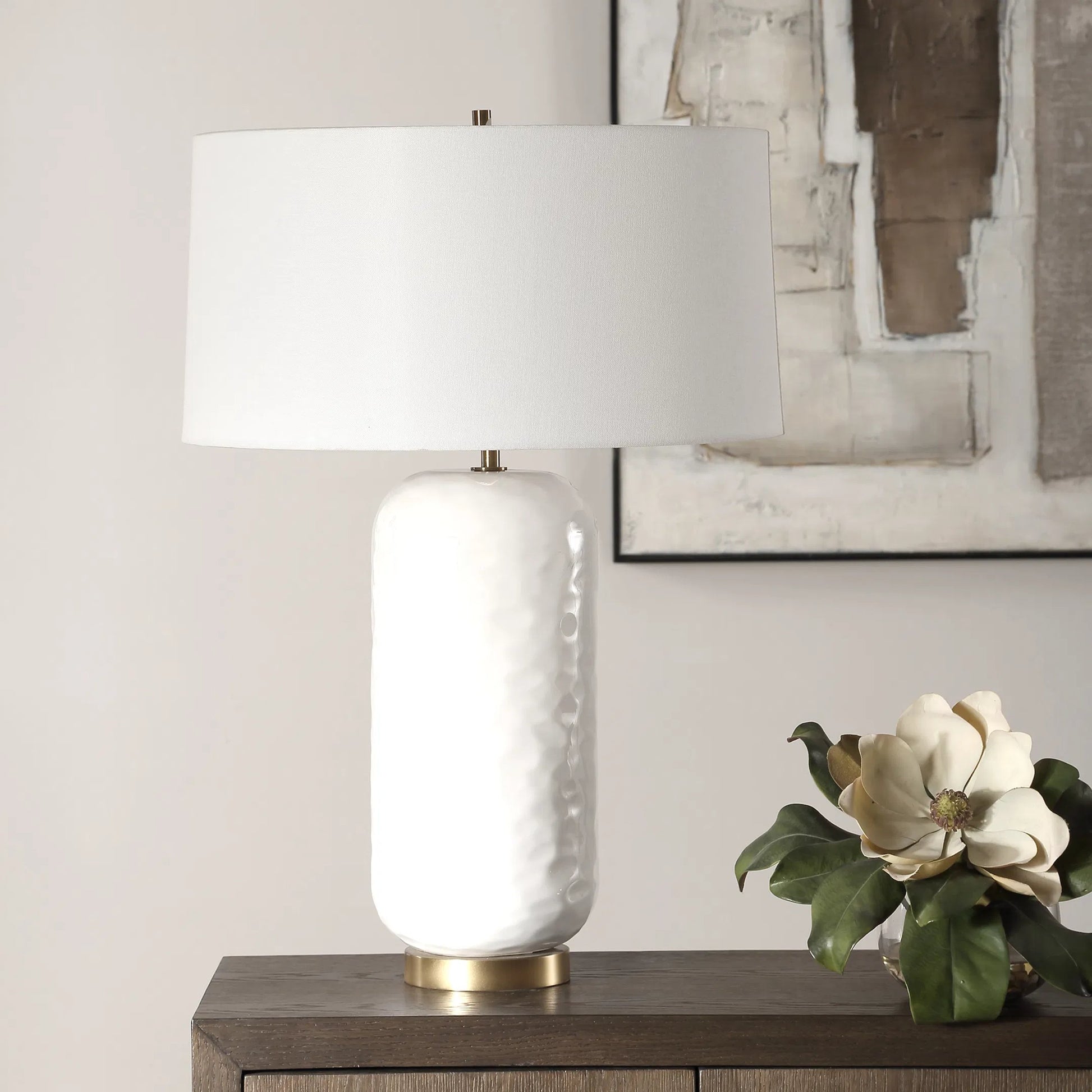 Iona Glaze Table Lamp by Uttermost in brass. Made from ceramic, metal, fabric in a transitional style.
