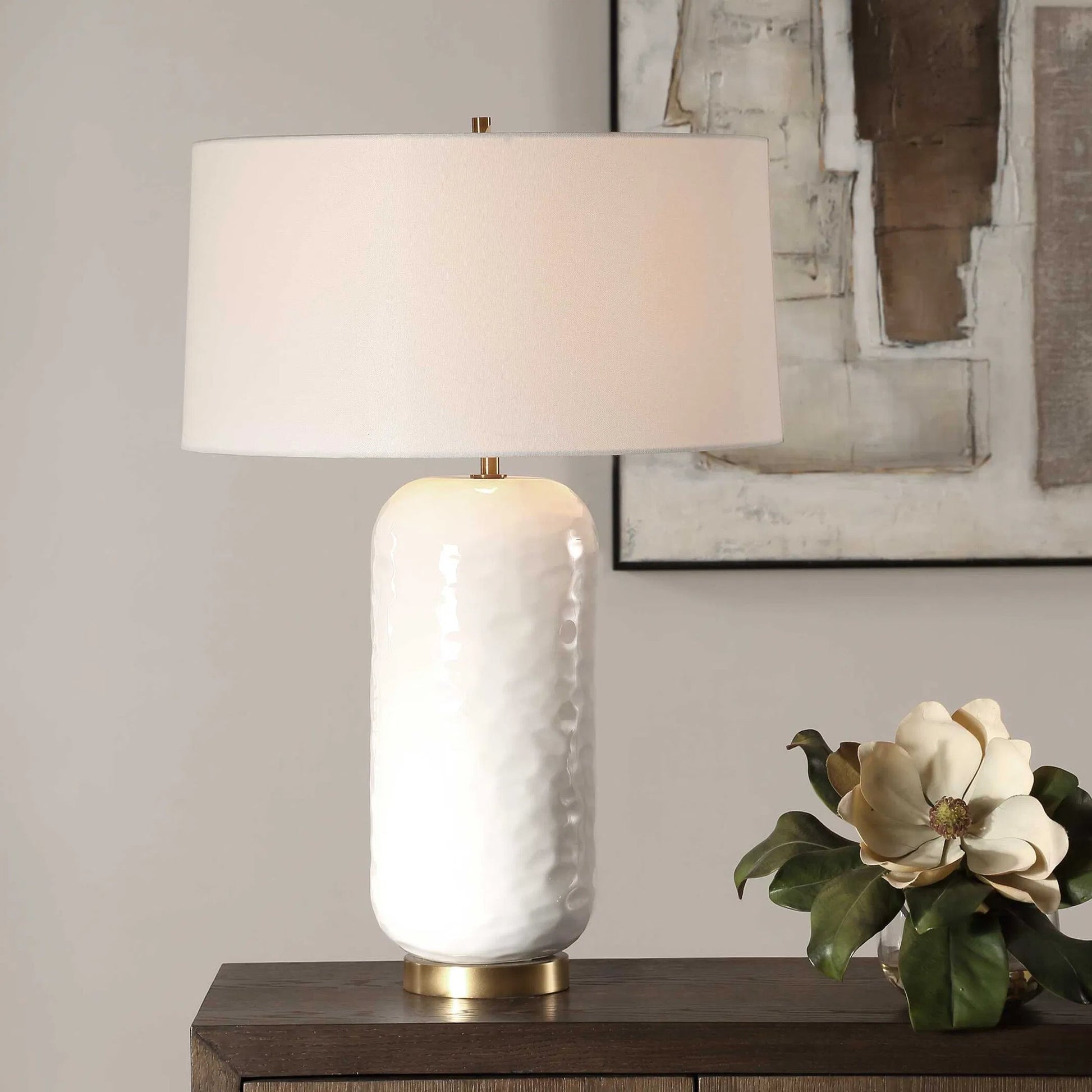 Iona Glaze Table Lamp by Uttermost in brass. Made from ceramic, metal, fabric in a transitional style.