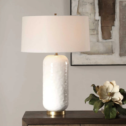 Iona Glaze Table Lamp by Uttermost in brass. Made from ceramic, metal, fabric in a transitional style.