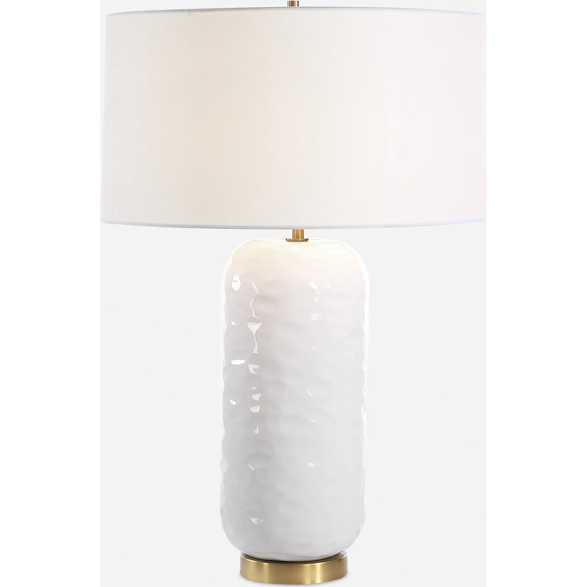 Iona Glaze Table Lamp by Uttermost in brass. Made from ceramic, metal, fabric in a transitional style.