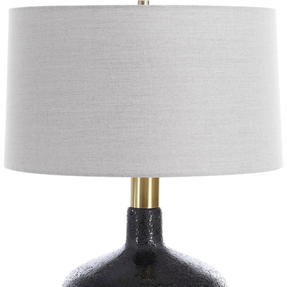 Flanagan Mottled Gloss Table Lamp by Uttermost in brass. Made from steel, ceramic, fabric in a modern style.