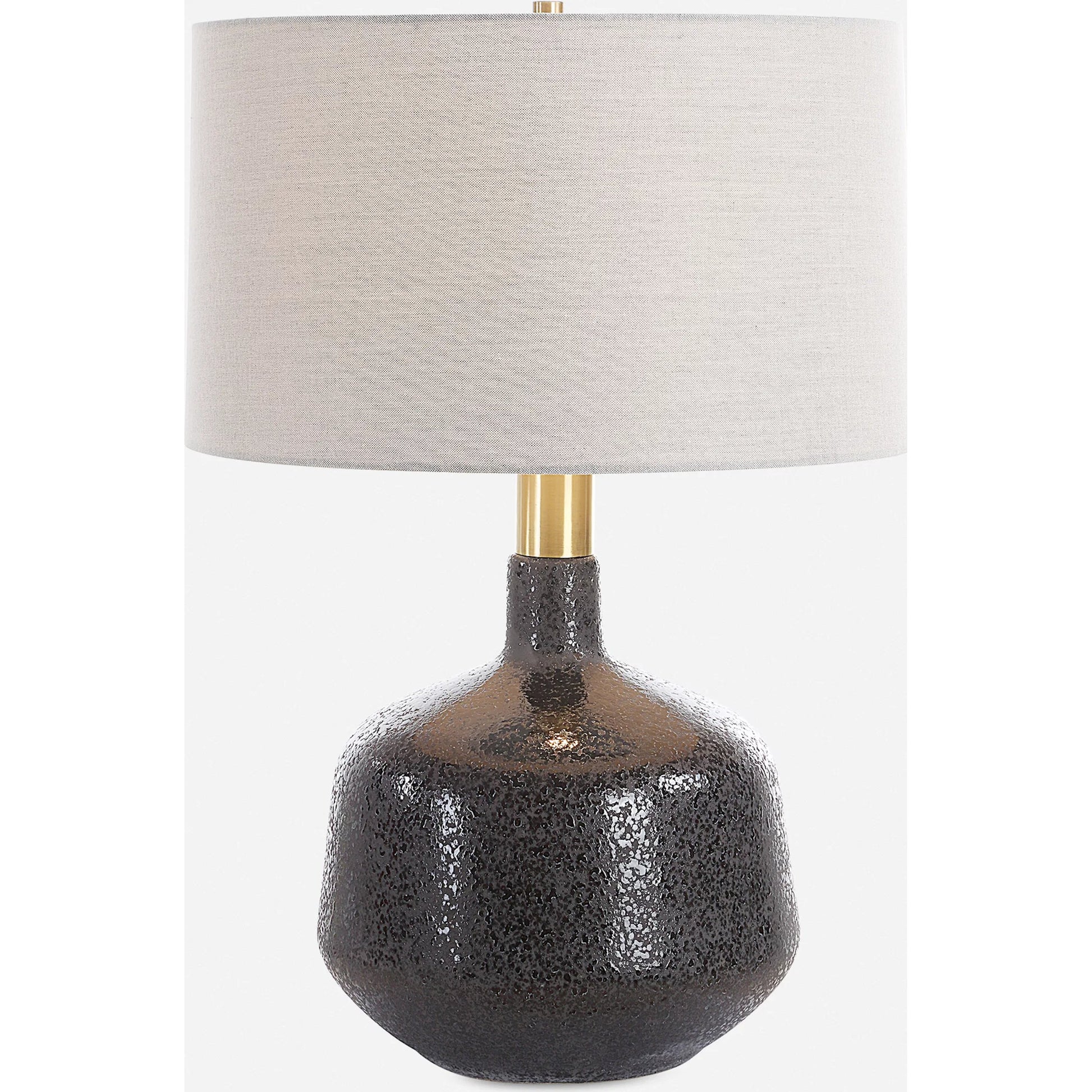 Flanagan Mottled Gloss Table Lamp by Uttermost in brass. Made from steel, ceramic, fabric in a modern style.