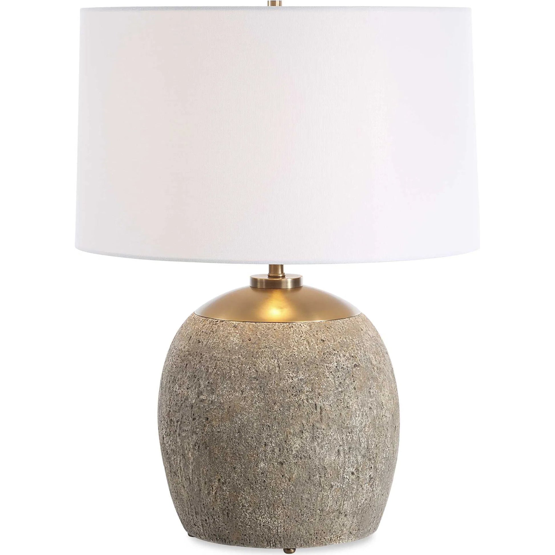Raylan Textured Table Lamp by Uttermost in brass. Made from metal, cement, fabric in a modern style.