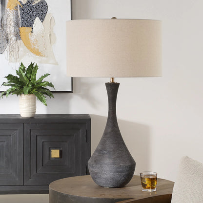 Helston Table Lamp by Uttermost in dark charcoal. Made from metal, ceramic, fabric in a modern style.