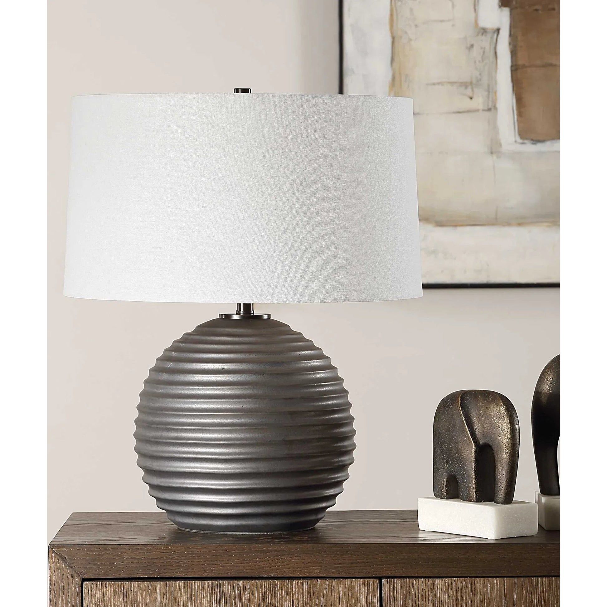 Chelsom Ribbed Table Lamp by Uttermost in dark bronze. Made from metal, ceramic, fabric in a modern style.