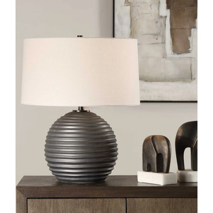 Chelsom Ribbed Table Lamp by Uttermost in dark bronze. Made from metal, ceramic, fabric in a modern style.