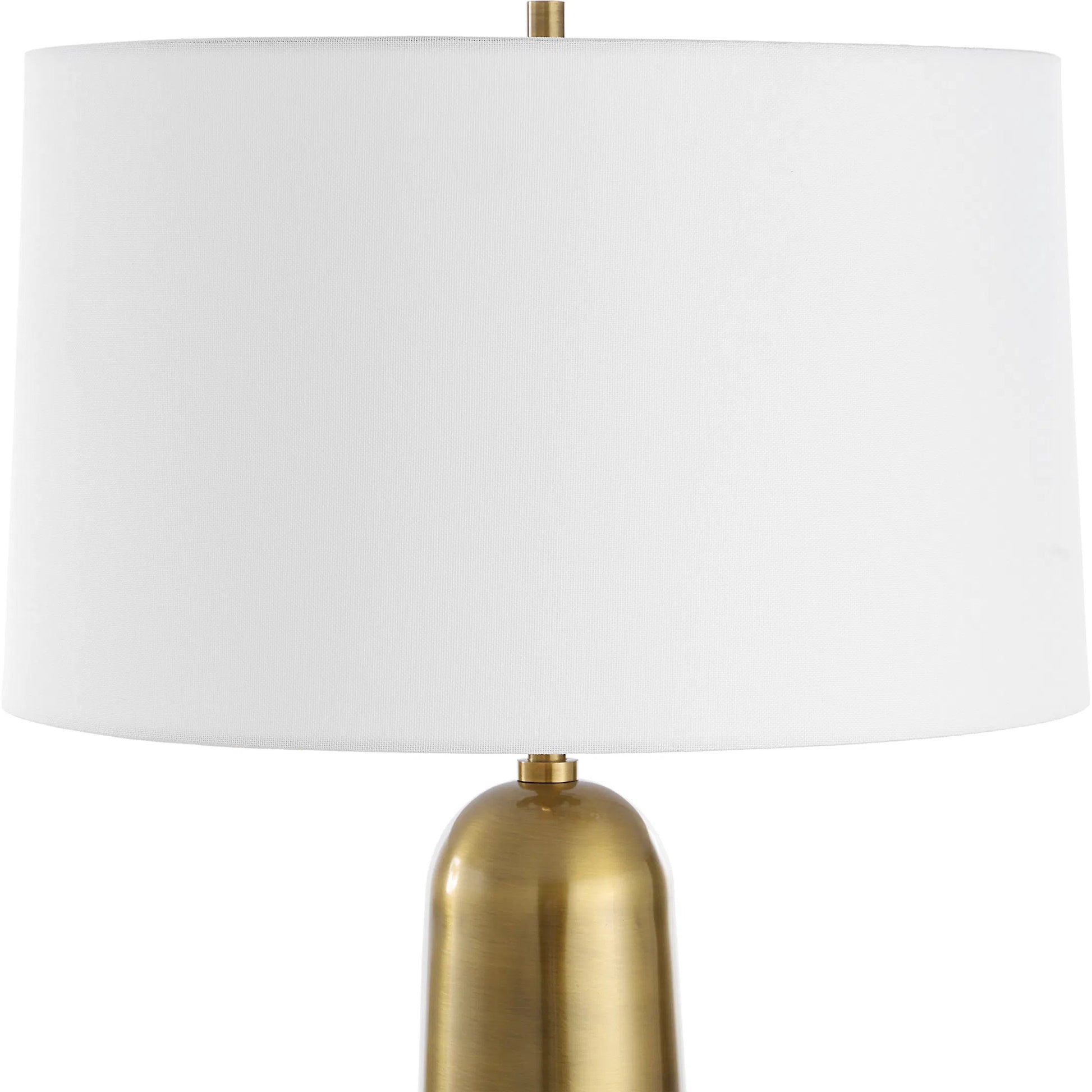 Flinchem Table Lamp by Uttermost in brass. Made from iron, fabric in a modern style.