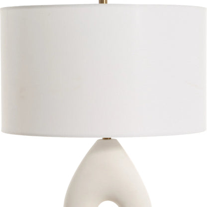 Meridian Table Lamp by Uttermost in brass. Made from resin, iron, fabric in a modern style.