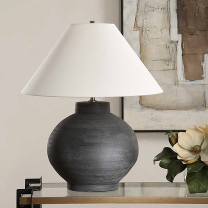 Tramore Rustic Table Lamp by Uttermost in brass. Made from porcelain, fabric, steel in a modern style.