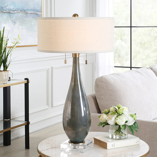 Cardoni Smoke Table Lamp by Uttermost in bronze. Made from metal, glass, crystal, linen in a modern style.
