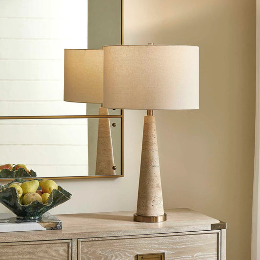 Perkins Travertine Table Lamp by Uttermost in brown and brass. Made from travertine, iron, fabric in a unique style.