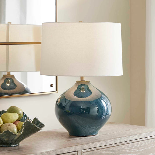 Corrine Table Lamp by Uttermost in blue and brass. Made from ceramic, fabric, iron in a unique style.