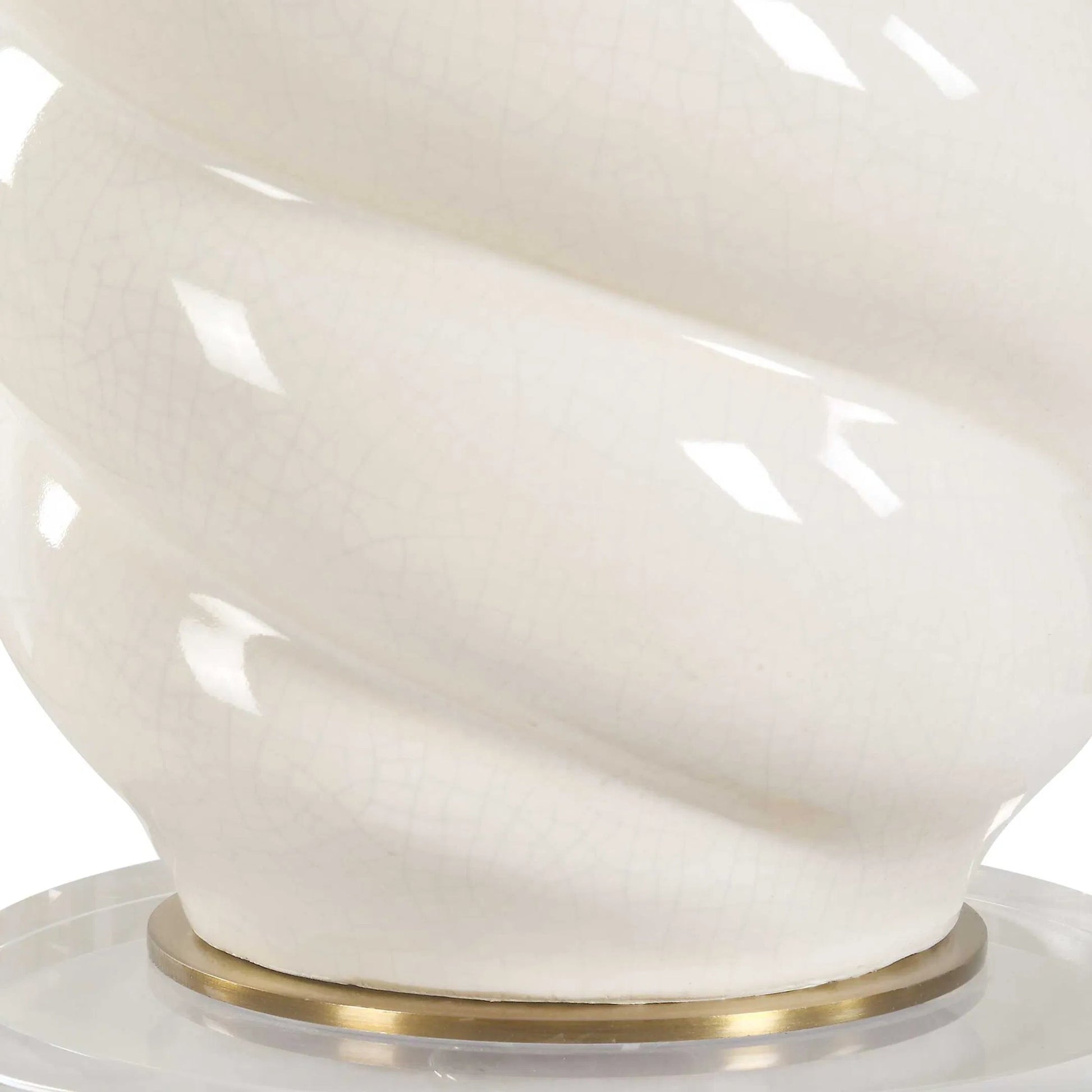 Anneli Swirl Table Lamp by Uttermost in ivory, brass. Made from ceramic, crystal, iron, fabric in a modern style.