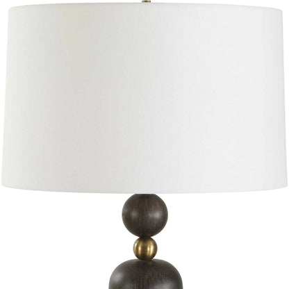 McQuinn Table Lamp by Uttermost in dark walnut. Made from metal, wood, %fabric in a traditional style.