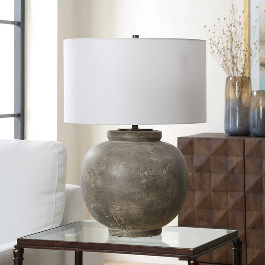 Rock of Ages Table Lamp by Uttermost in gray, rust brown and bronze. Made from ceramic, iron, fabric in a rustic style.