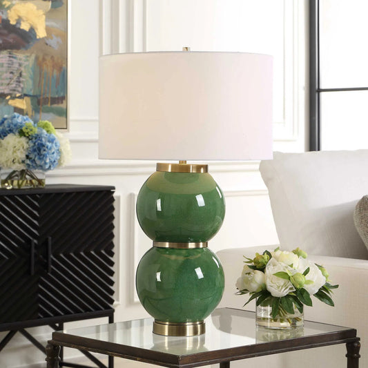 Banner Spheres Table Lamp by Uttermost in green and brass. Made from metal, ceramic, fabric in a unique style.
