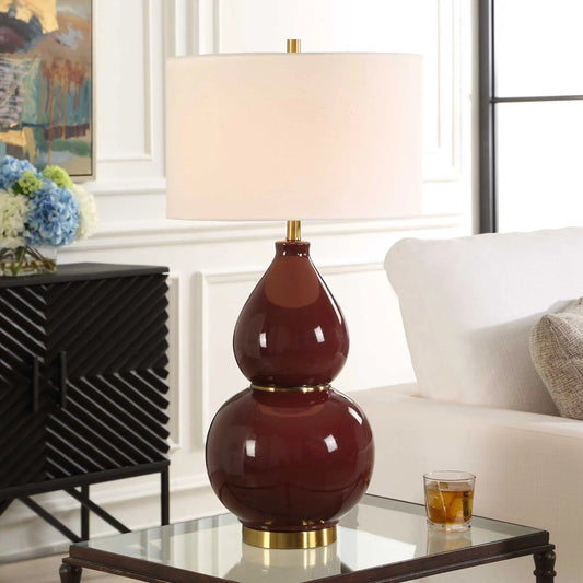 Gourd Burgundy Table Lamp by Uttermost in red and brass. Made from metal, ceramic, fabric in a unique style.