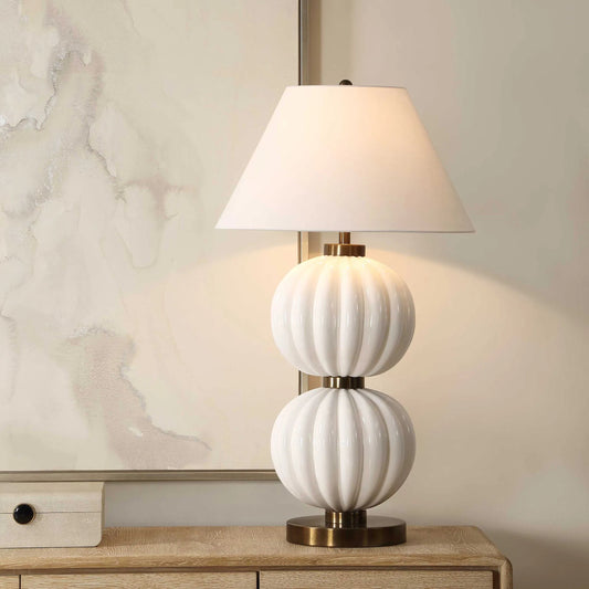Irena Sphere Table Lamp by Uttermost in white and brass. Made from ceramic, iron in a unique style.