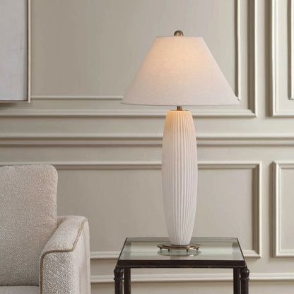 Brinsley Table Lamp by Uttermost in white and brass. Made from metal, ceramic, fabric in a unique style.