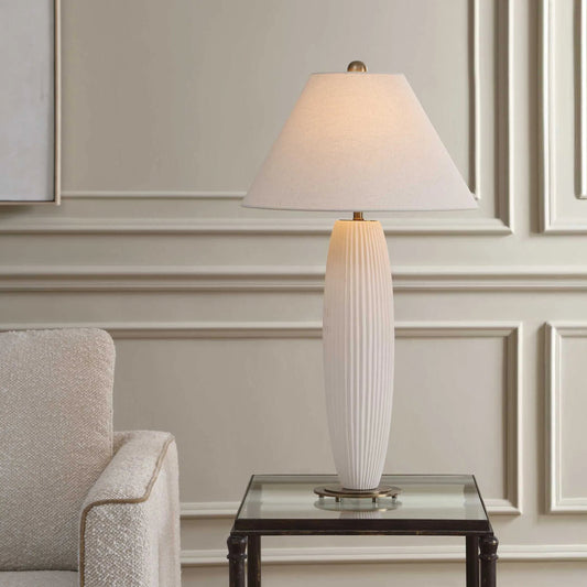 Brinsley Table Lamp by Uttermost in white and brass. Made from metal, ceramic, fabric in a unique style.