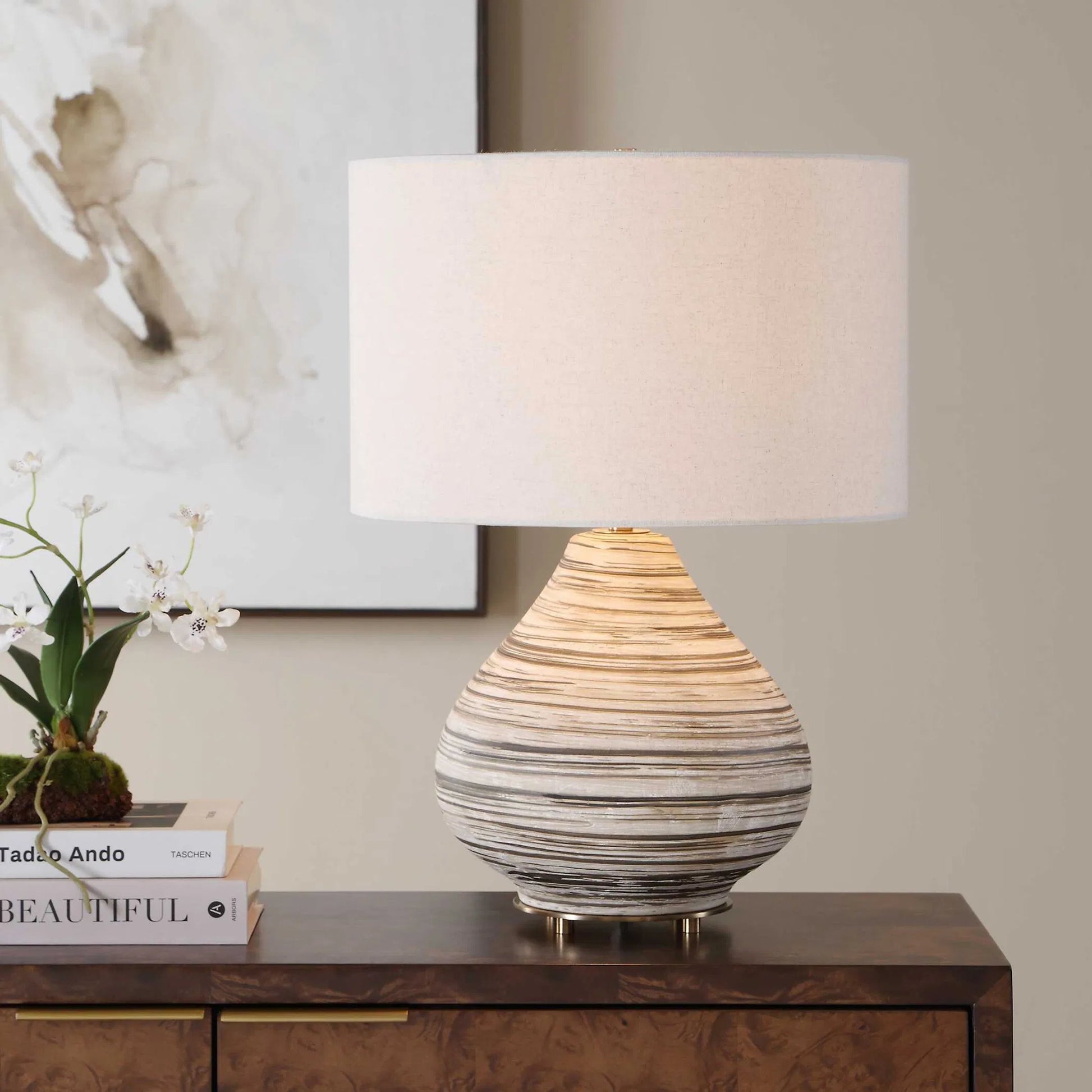 Azura Horizontal Line Table Lamp by Uttermost in brown, gray, white and dark. Made from ceramic, iron, fabric in a unique style.