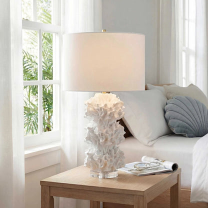 Cambre Coral Table Lamp by Uttermost in white and brass. Made from resin, crystal, iron in a unique style.