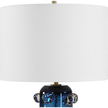 Aura Table Lamp by Uttermost in blue, brass, gold and brass. Made from glass, iron in a unique style.