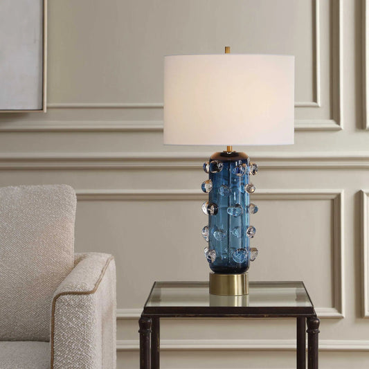 Aura Table Lamp by Uttermost in blue, brass, gold and brass. Made from glass, iron in a unique style.