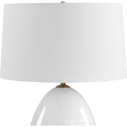 Avery Glaze Table Lamp by Uttermost in white and brass. Made from ceramic, fabric, iron in a unique style.