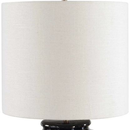 Andrus Glaze Table Lamp by Uttermost in blue and brass. Made from ceramic, fabric, iron in a unique style.