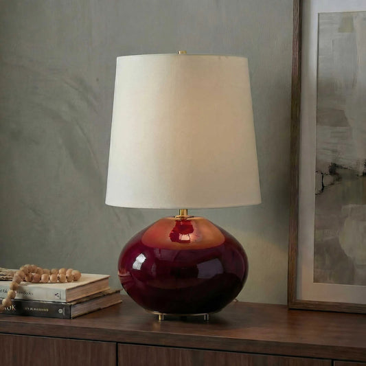 Allemand Table Lamp by Uttermost in red and dark. Made from ceramic, iron, fabric in a unique style.