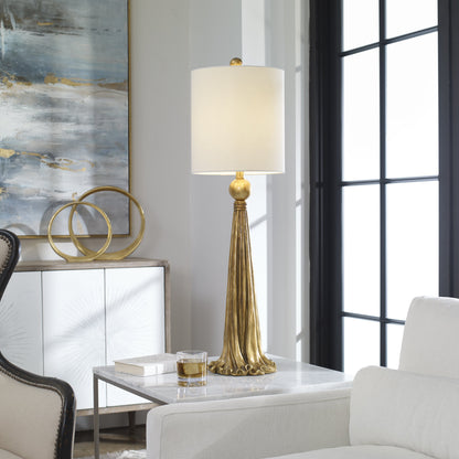 Paravani Lamp by Uttermost in gold. Made from resin, steel, fabric in a modern style.