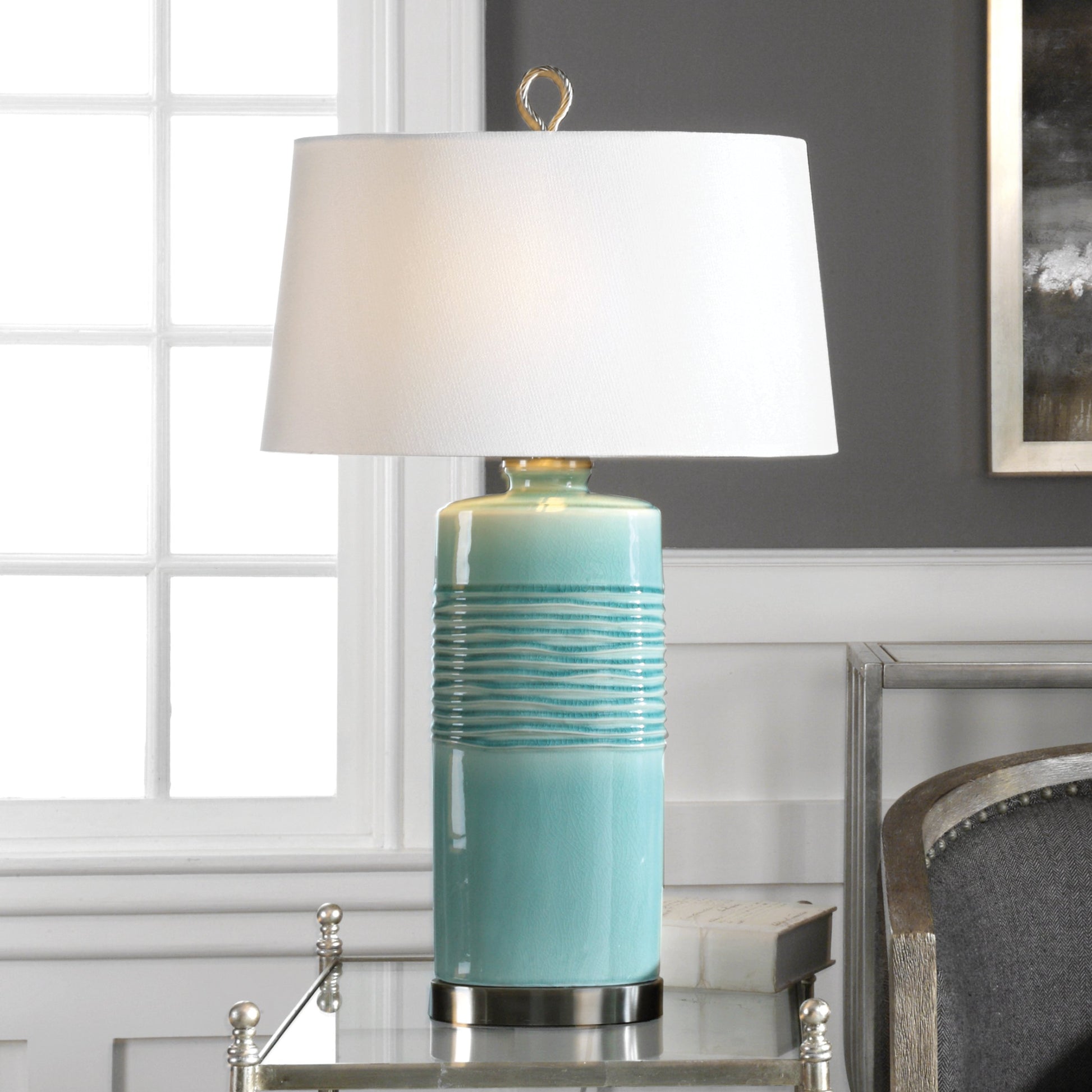 Rila Distressed Teal Table Lamp by Uttermost. Made from ceramic, iron in a modern style.