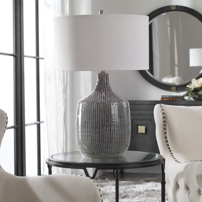 Felipe Table Lamp by Uttermost in light gray. Made from ceramic, iron, fabric in a eclectic & global style.