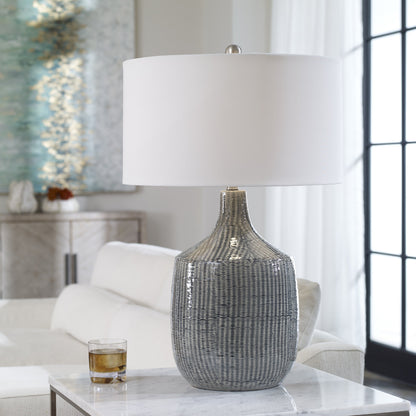 Felipe Table Lamp by Uttermost in light gray. Made from ceramic, iron, fabric in a eclectic & global style.